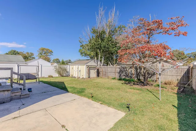 a view of a backyard with a garden and plants
