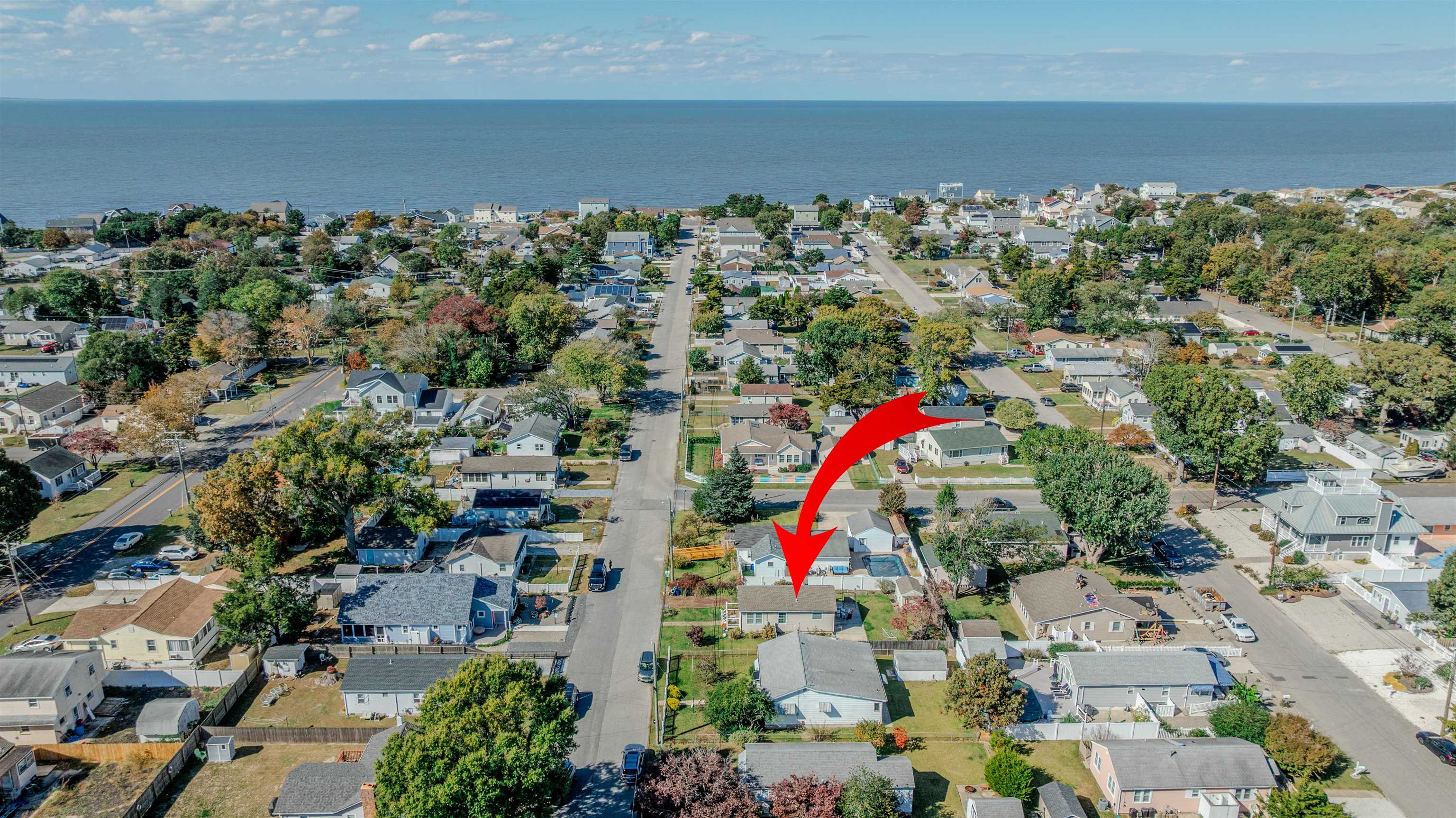 143 Arbor Road Villas, NJ 08251 - Photo 28 of 32 an aerial view of a houses with a yard and lake view