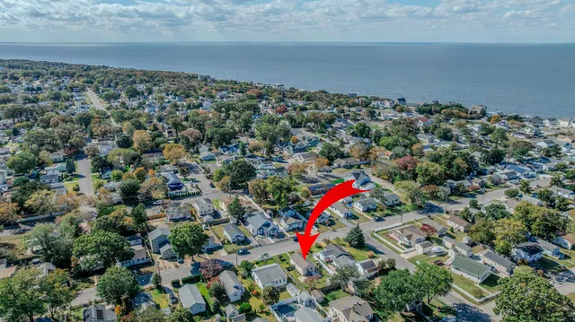 an aerial view of a houses with a yard