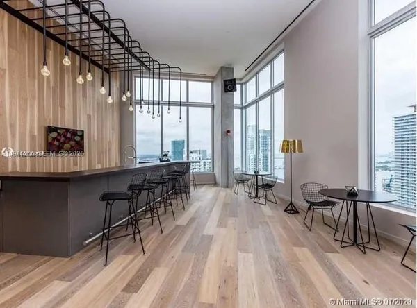 a kitchen with stainless steel appliances granite countertop a stove and a refrigerator