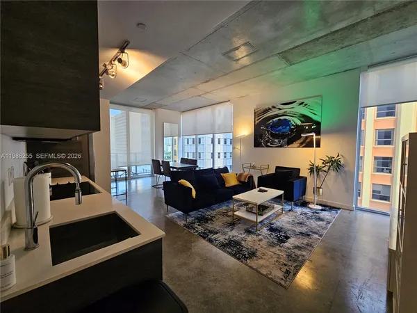 a bedroom with a bed and a couch