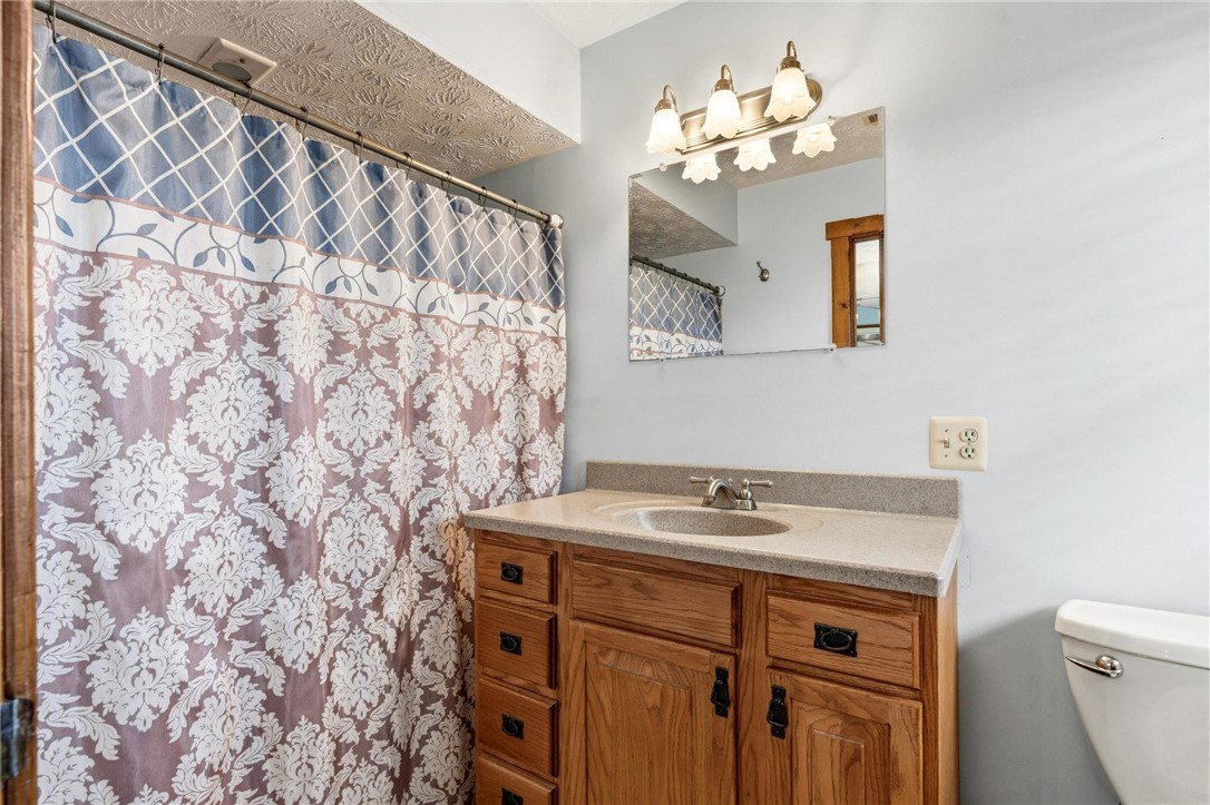 4971 Lackey Road Cedarville, OH 45314 - Photo 38 of 79 This bathroom features a functional vanity with a sleek countertop and practical storage.