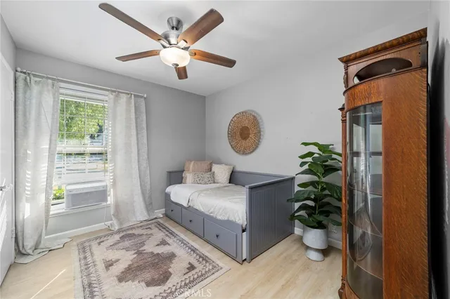 a bed room with a bed and a window