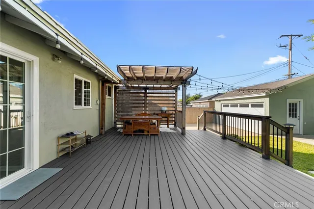 a view of a balcony with wooden floor