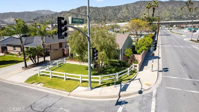 a view of a swimming pool with a garden and plants