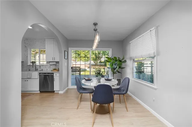 a dining room with furniture and window