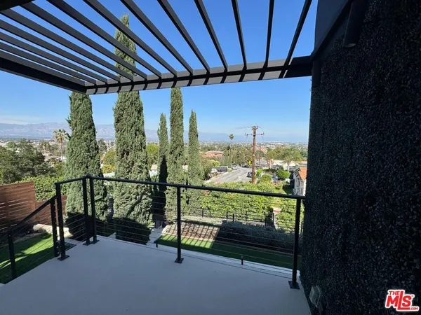 a view of a two chairs in the balcony