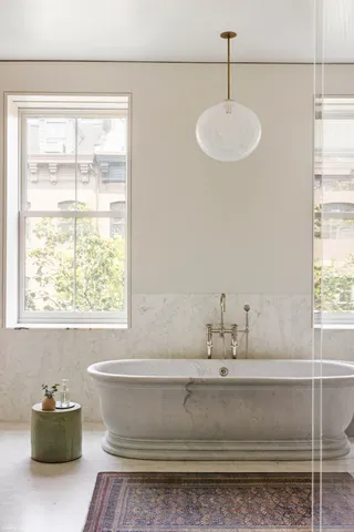 a bathroom with a sink and a window