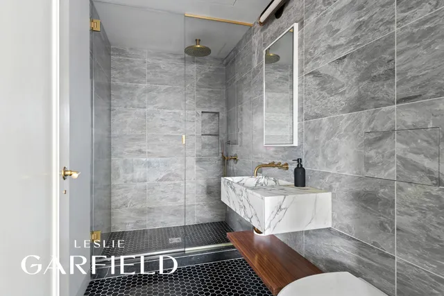 a bathroom with a bathtub and shower