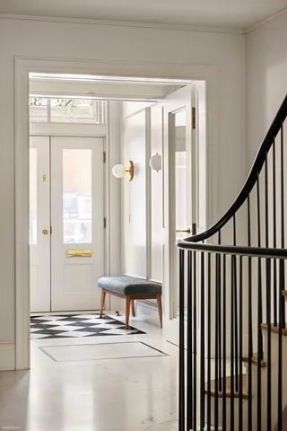 a view of a balcony with floor to ceiling window and floor