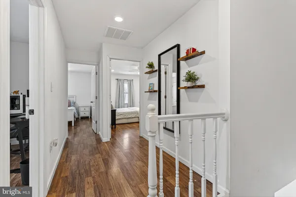 a room that has a bed and a chair in it