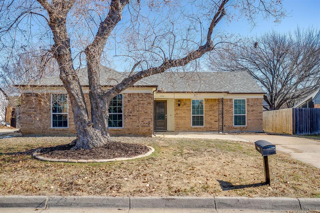 7312 Strawberry Way Fort Worth, TX 76137 - Photo 1 of 40 a front view of a house with garden