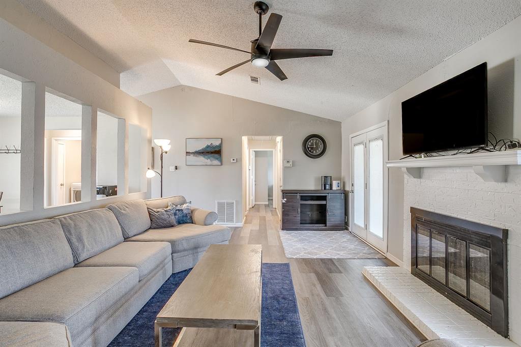 7312 Strawberry Way Fort Worth, TX 76137 - Photo 11 of 40 a living room with furniture and a flat screen tv