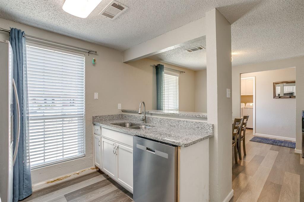 7312 Strawberry Way Fort Worth, TX 76137 - Photo 21 of 40 a bathroom with a granite countertop sink and a mirror