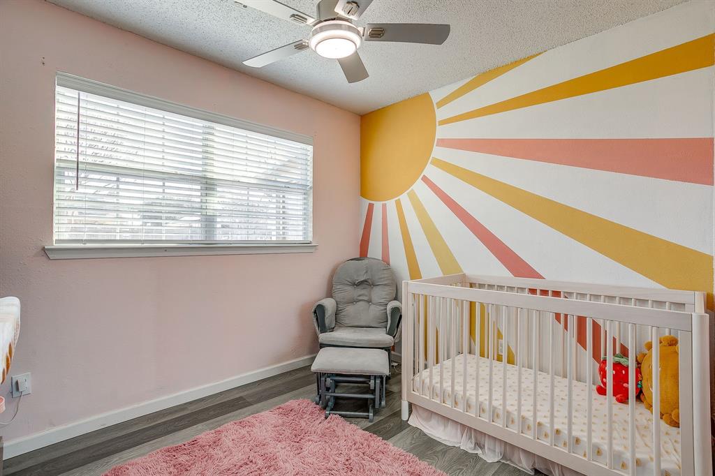7312 Strawberry Way Fort Worth, TX 76137 - Photo 30 of 40 a bedroom with a bed and a window