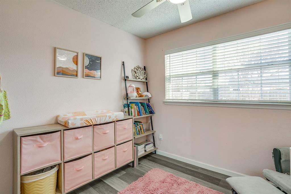 7312 Strawberry Way Fort Worth, TX 76137 - Photo 33 of 40 a bedroom with furniture and a window
