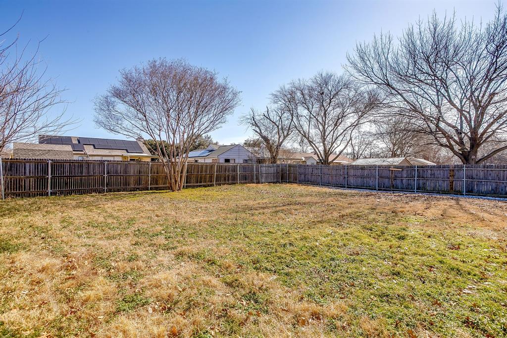 7312 Strawberry Way Fort Worth, TX 76137 - Photo 40 of 40 a swimming pool with wooden fence