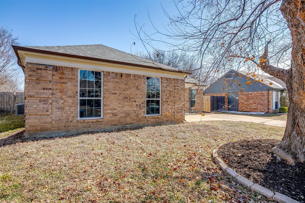 7312 Strawberry Way Fort Worth, TX 76137 - Photo 5 of 40 a front view of a house with a yard