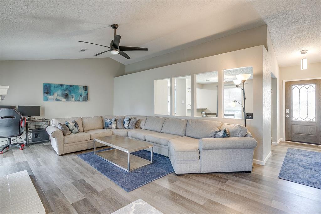 7312 Strawberry Way Fort Worth, TX 76137 - Photo 9 of 40 a living room with furniture and a large window
