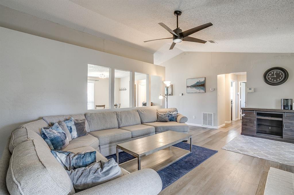 7312 Strawberry Way Fort Worth, TX 76137 - Photo 10 of 40 a living room with furniture and a large window