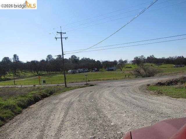 1943 South Ranchero Road Valley Springs, CA 95252 - Photo 19 of 21 View of dirt / gravel road featuring a rural view