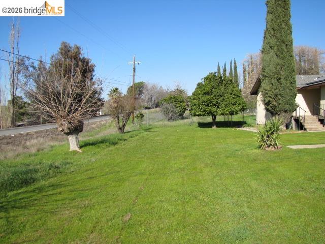 1943 South Ranchero Road Valley Springs, CA 95252 - Photo 2 of 21 View of green lawn