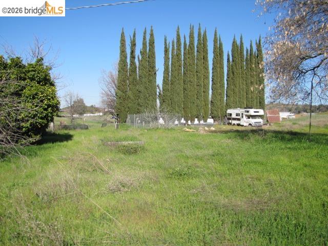 1943 South Ranchero Road Valley Springs, CA 95252 - Photo 4 of 21 a view of a yard with a house in the background