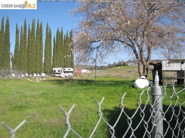1943 South Ranchero Road Valley Springs, CA 95252 - Photo 5 of 21 a view of a golf club with a table and a chairs