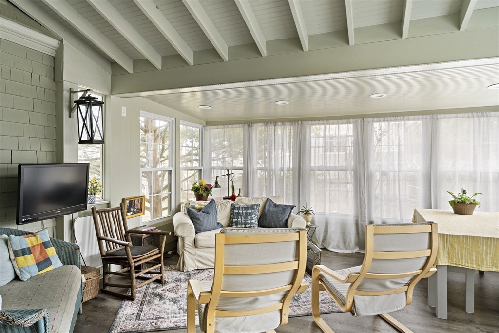 52 Hillside Road Watertown, MA 02472 - Photo 12 of 27 a living room with fireplace furniture and a flat screen tv