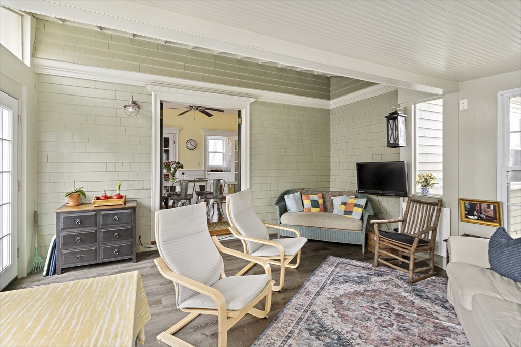 52 Hillside Road Watertown, MA 02472 - Photo 13 of 27 a living room with furniture and a flat screen tv