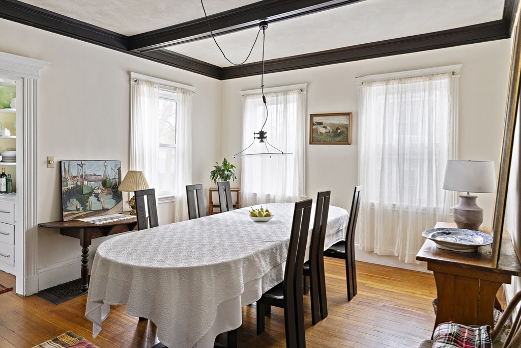 52 Hillside Road Watertown, MA 02472 - Photo 14 of 27 a view of a dining room with furniture and wooden floor