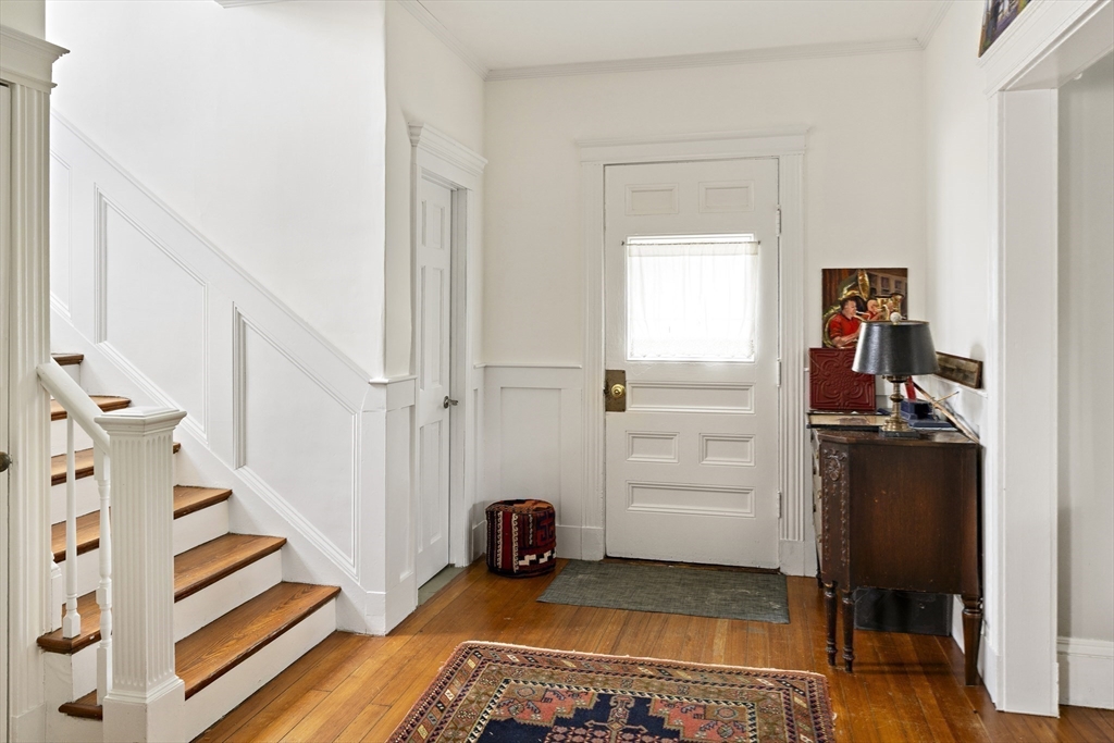 52 Hillside Road Watertown, MA 02472 - Photo 15 of 27 a view of a livingroom with furniture and an empty room