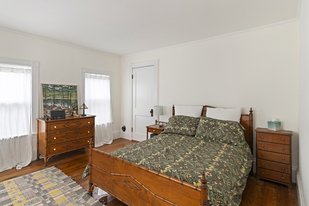 52 Hillside Road Watertown, MA 02472 - Photo 18 of 27 a bed room with a bed and a dresser