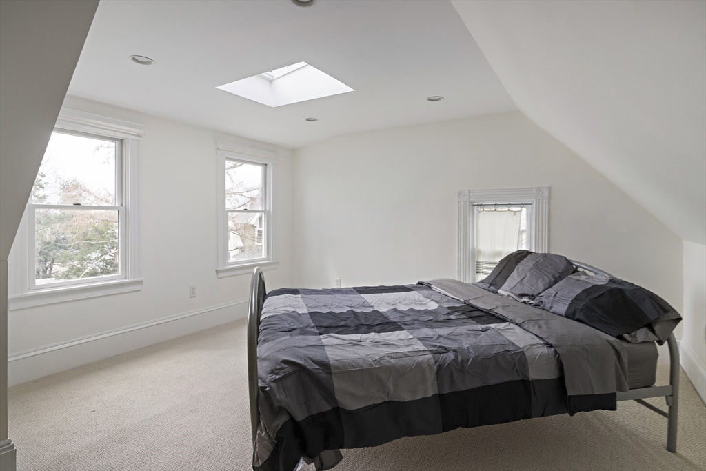 52 Hillside Road Watertown, MA 02472 - Photo 20 of 27 a bedroom with a bed and a window