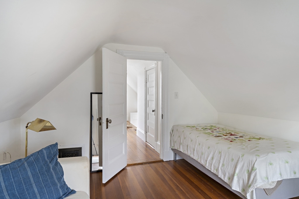 52 Hillside Road Watertown, MA 02472 - Photo 21 of 27 a bedroom with a bed and a dresser