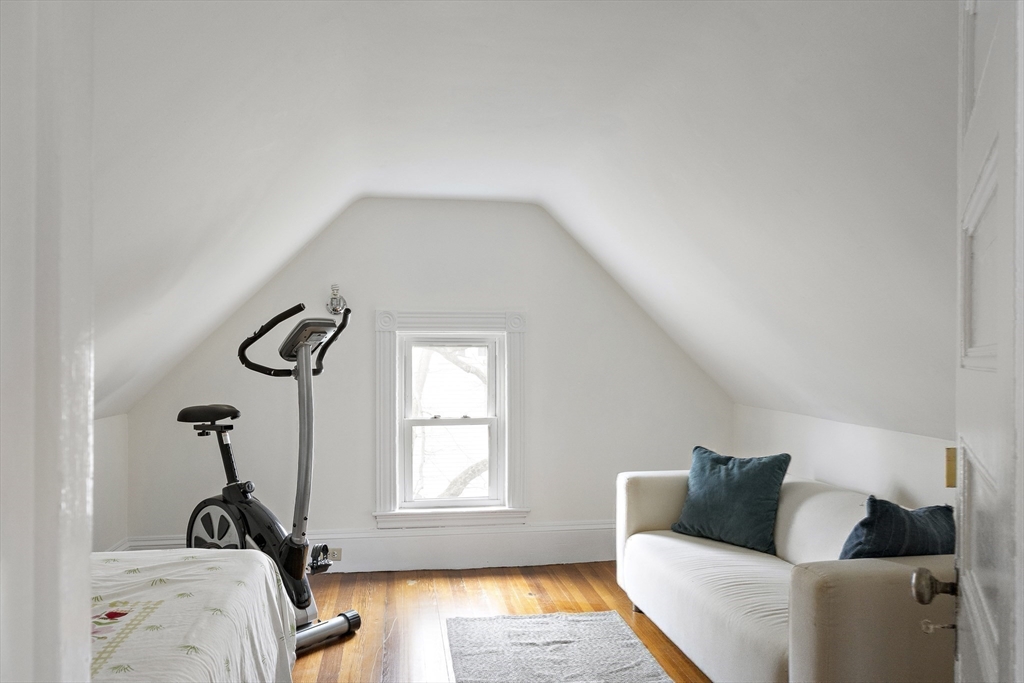 52 Hillside Road Watertown, MA 02472 - Photo 22 of 27 a living room with furniture and a window