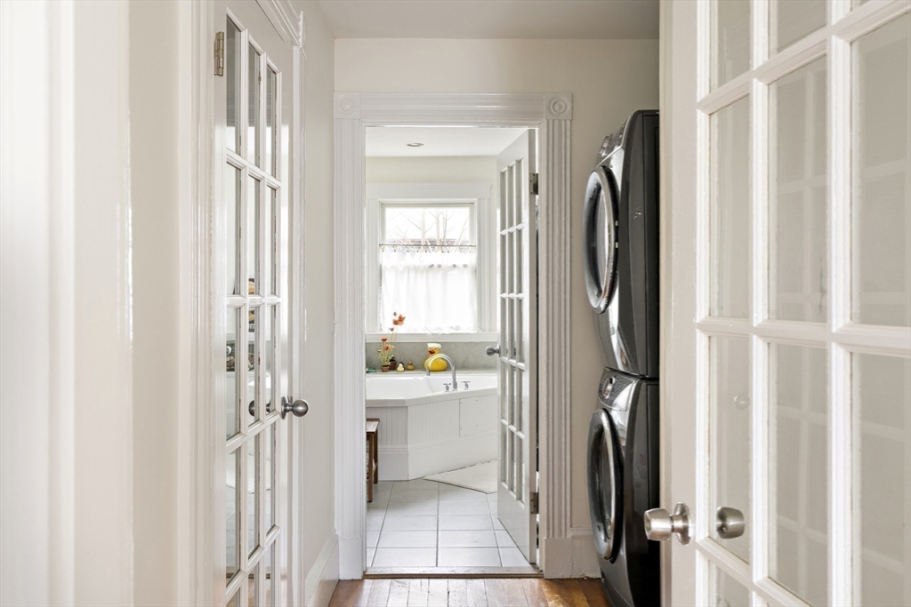 52 Hillside Road Watertown, MA 02472 - Photo 24 of 27 a view of a bathroom with a sink and a refrigerator
