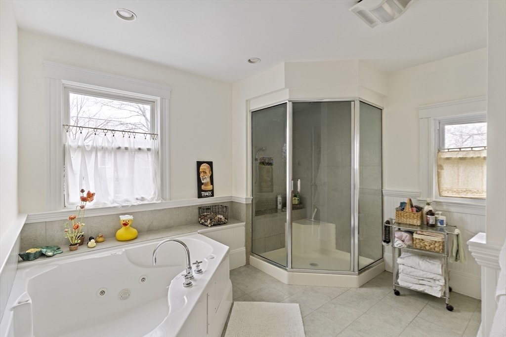 52 Hillside Road Watertown, MA 02472 - Photo 26 of 27 a bathroom with a tub and shower