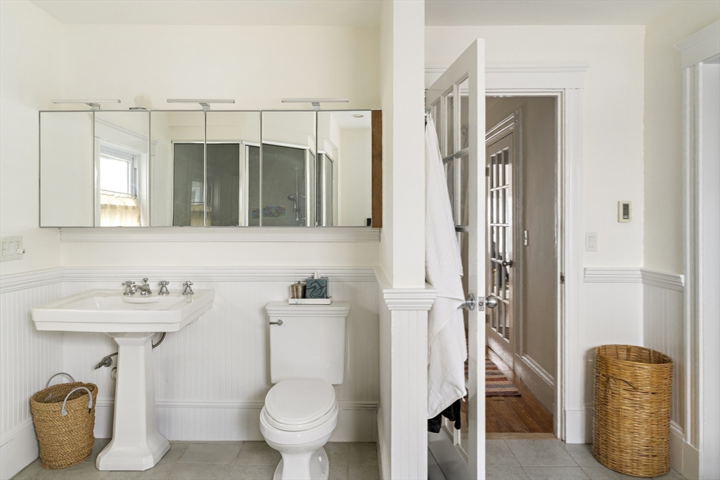 52 Hillside Road Watertown, MA 02472 - Photo 27 of 27 a bathroom with a toilet sink and shower