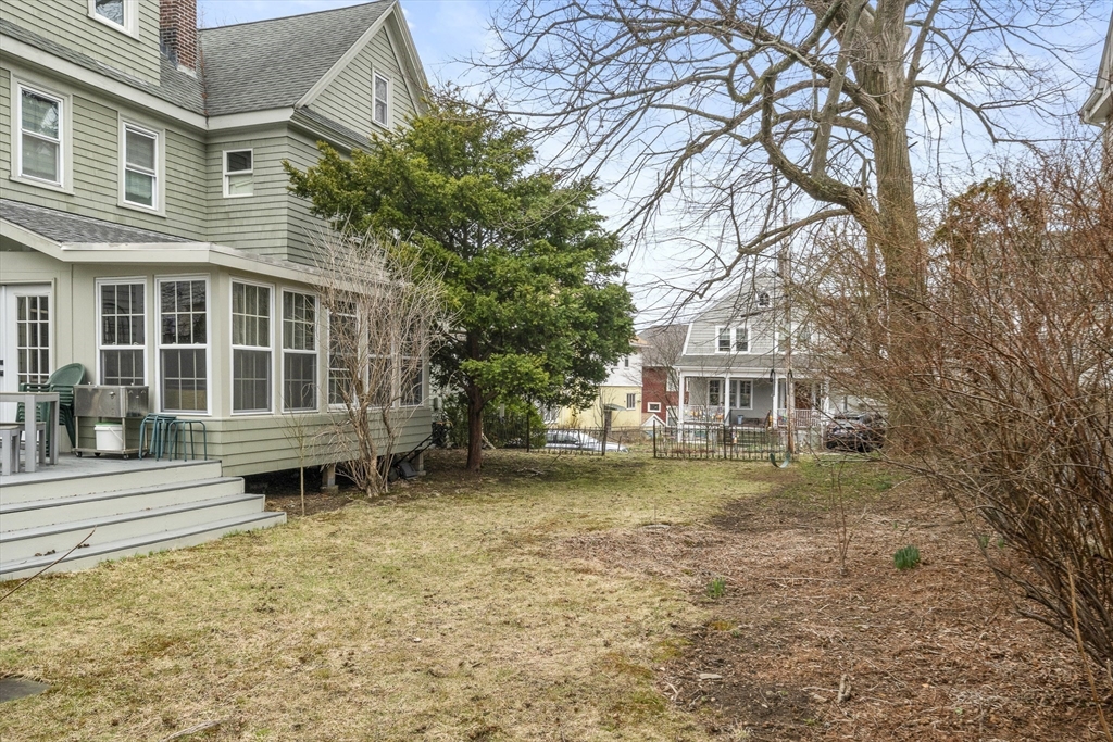 52 Hillside Road Watertown, MA 02472 - Photo 4 of 27 a front view of a house with a garden