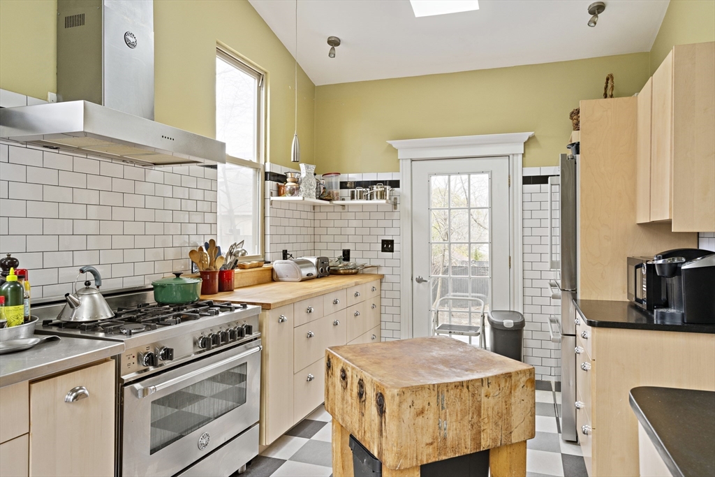 52 Hillside Road Watertown, MA 02472 - Photo 8 of 27 a kitchen that has a sink and a stove in it