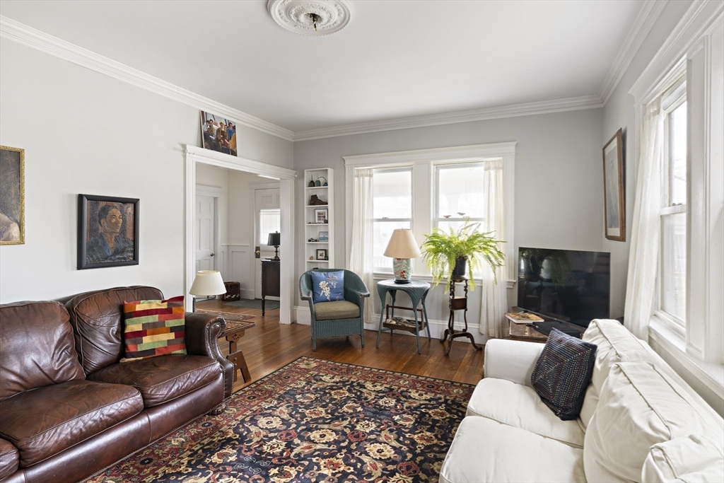 52 Hillside Road Watertown, MA 02472 - Photo 9 of 27 a living room with furniture fireplace and a window