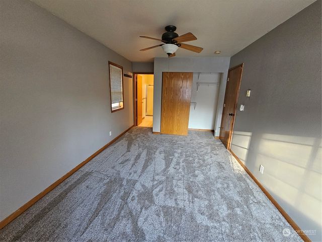 a view of a hallway with a window