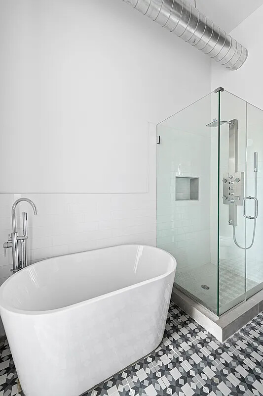 1137 Jefferson Avenue, Unit 3A Brooklyn, NY 11221 - Photo 7 of 10 a white bath tub sitting next to a shower