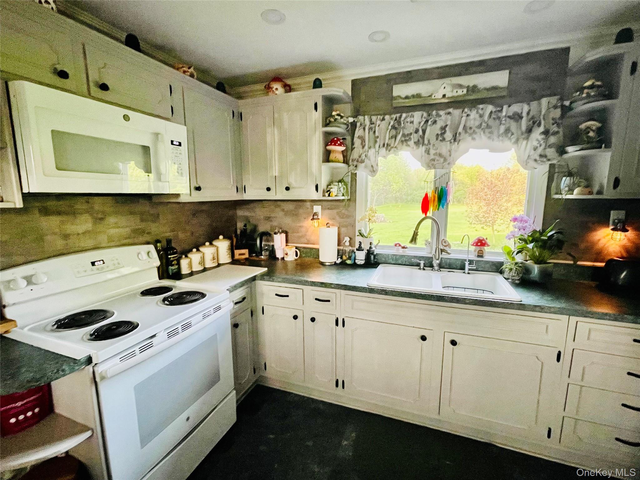 137 Cross Road Goshen, NY 10924 - Photo 7 of 50 a kitchen with granite countertop a sink and white cabinets