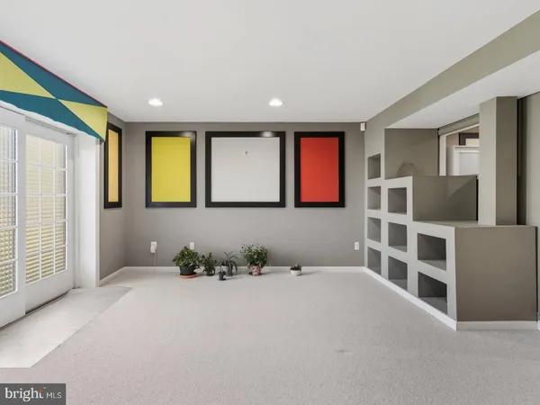 a room with gym equipment and a large window