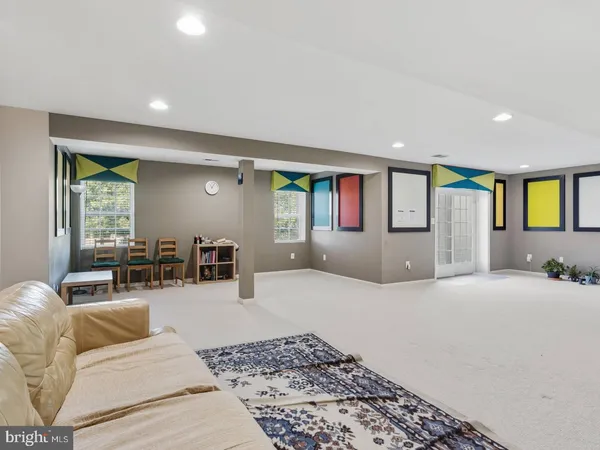 a view of room with wooden floor and bathroom