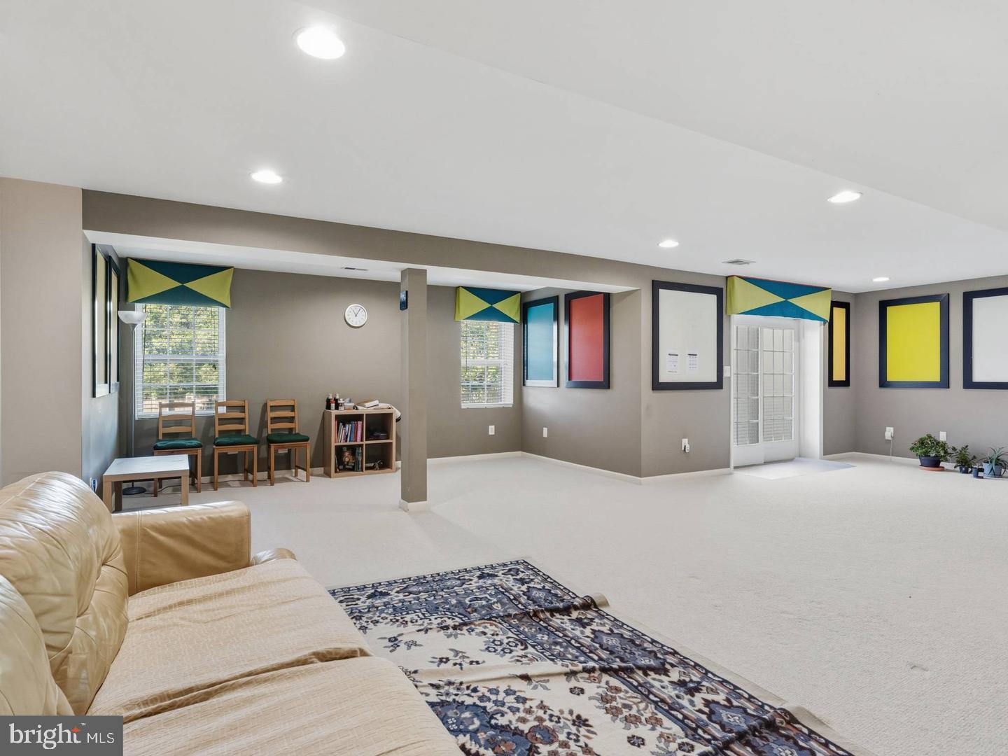 14301 Autumn Crest Road Boyds, MD 20841 - Photo 32 of 40 a living room with furniture and a flat screen tv