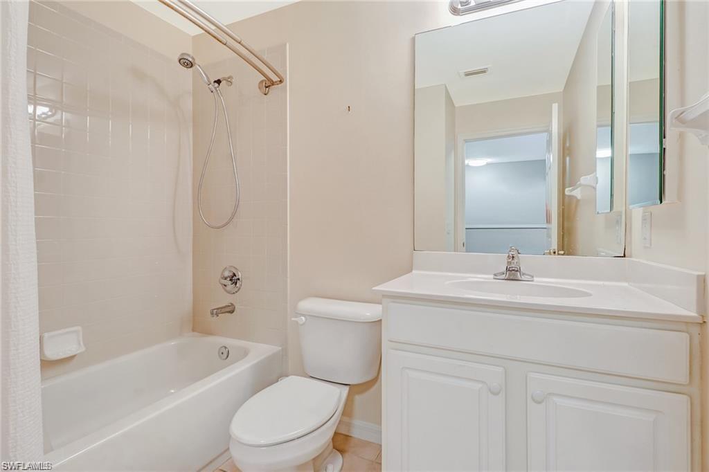 9801 Foxhall Way, Unit 4 Estero, FL 33928 - Photo 13 of 23 Bathroom with shower / tub combo and vanity