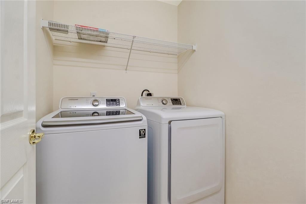 9801 Foxhall Way, Unit 4 Estero, FL 33928 - Photo 14 of 23 Laundry area featuring separate washer and dryer